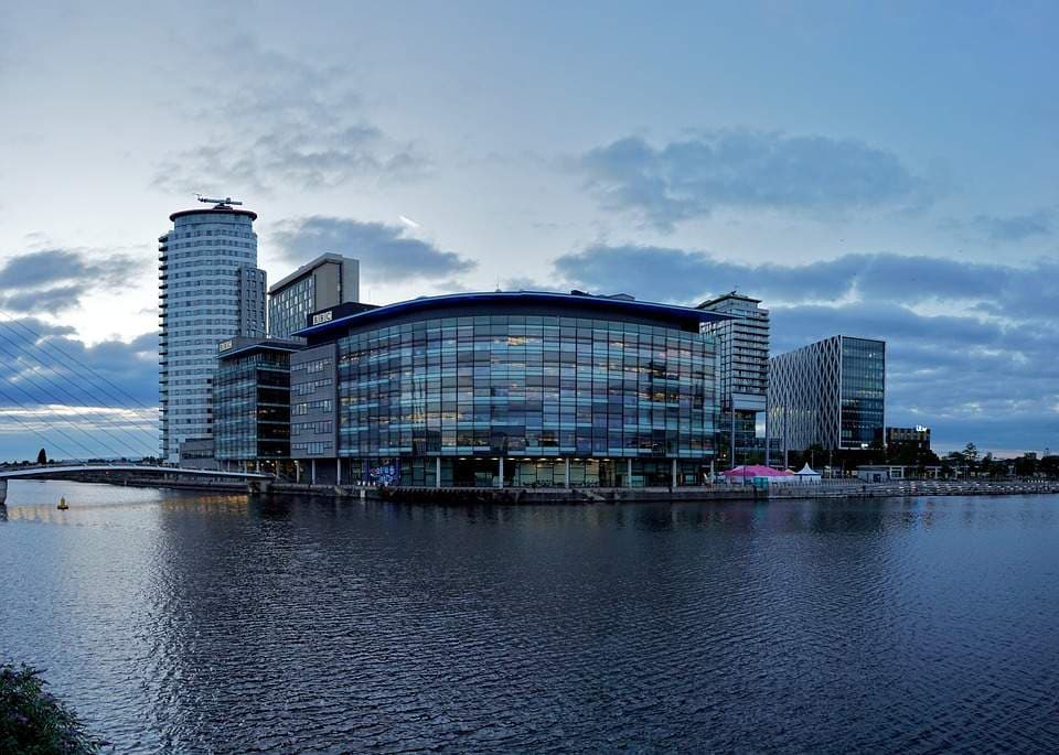 A vibrant city skyline with iconic landmarks and bustling streets, showcasing urban energy and charm