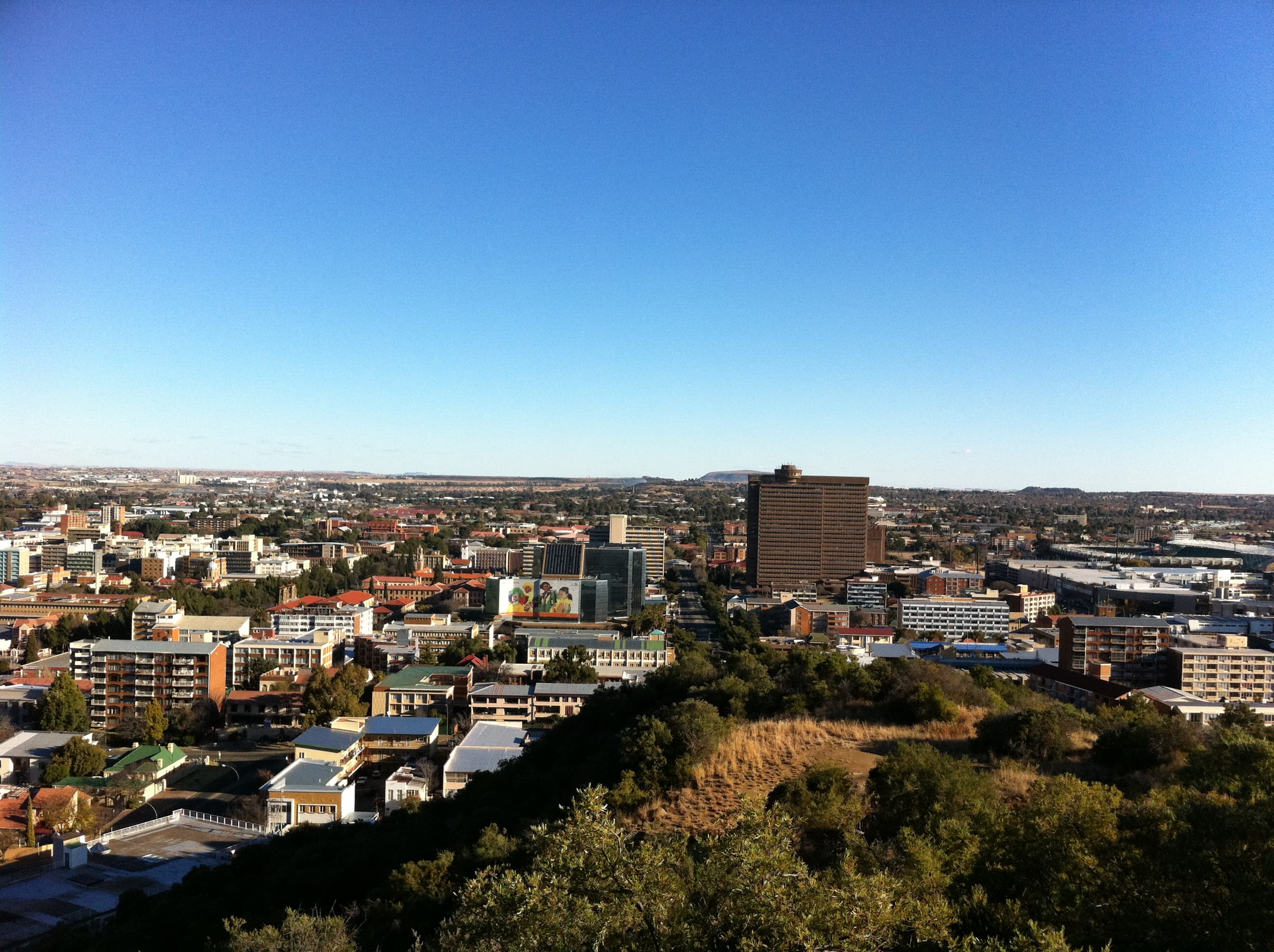 A vibrant city skyline with iconic landmarks and bustling streets, showcasing urban energy and charm